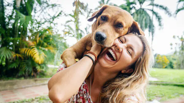 Smiling woman with dog